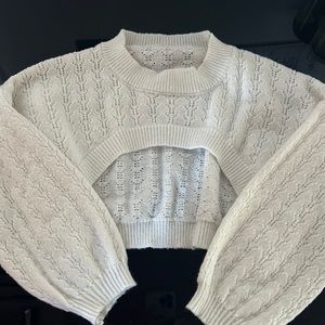 A cream colored half sweater.